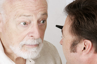 Eye Disease exam on elderly man